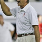 Alabama head coach Nick Saban yells during team warm ups before an NCAA college football game against Wisconsin, Saturday, Sept. 5, 2015, in Arlington, Texas. (AP Photo/LM Otero)